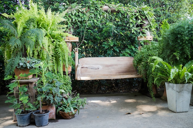 Wooden swing seat in outdoor garden