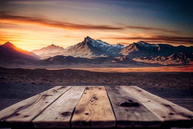 Wooden table and blur of beauty, sunset sky, and mountains as background