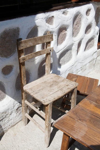 Wooden table and chair on cafe terracexAxA