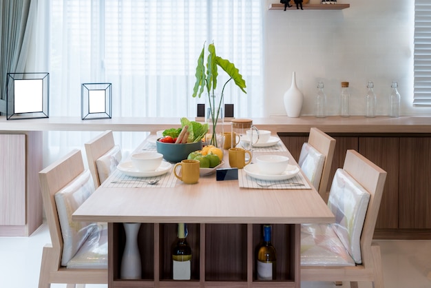 Wooden table and chair in modern dinning room at home. Interior of dinning room at home.