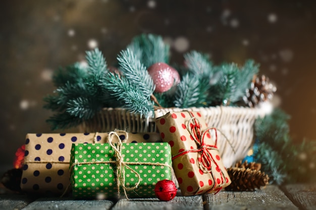  Wooden table decorated with Christmas gifts. Horizontal.