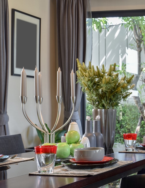 Wooden table in dining room with elegant table setting