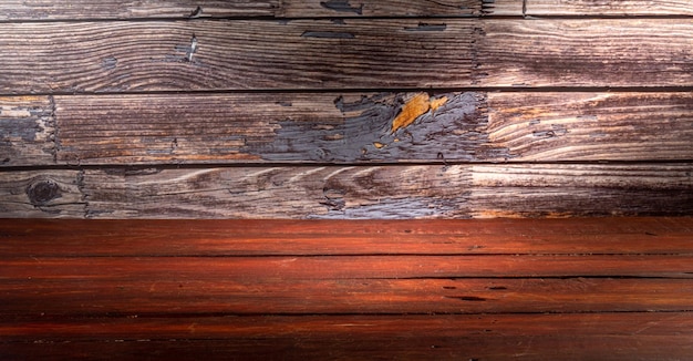 Photo wooden table in front of rustic wall with empty copy space