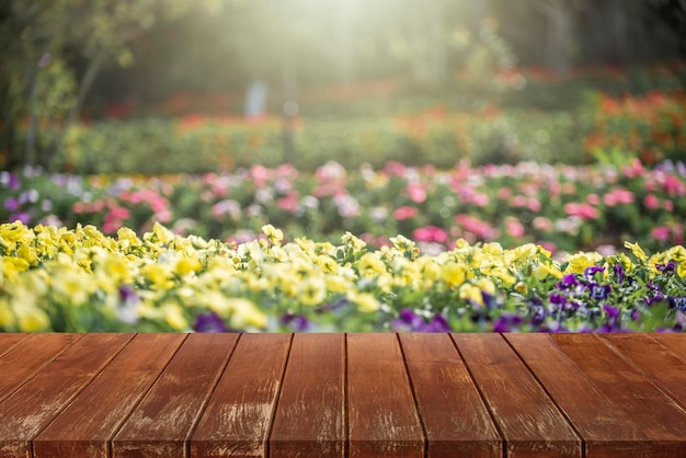 Wooden table top on blurred park background