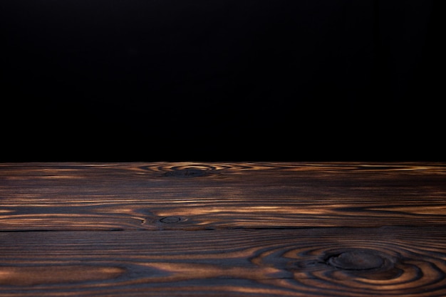 wooden table with black background