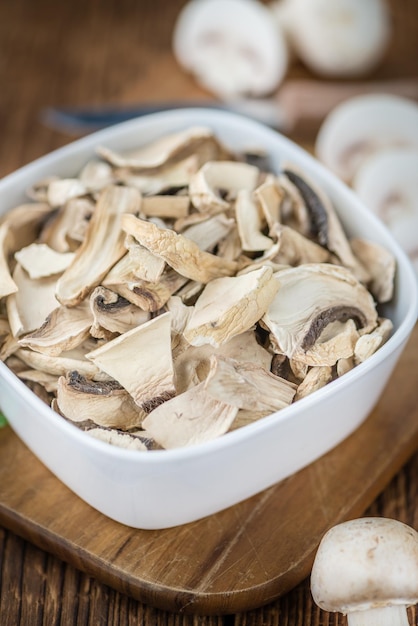 Wooden table with Dried white Mushrooms selective focus