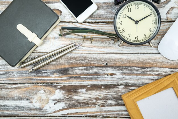 Wooden table with office supplies