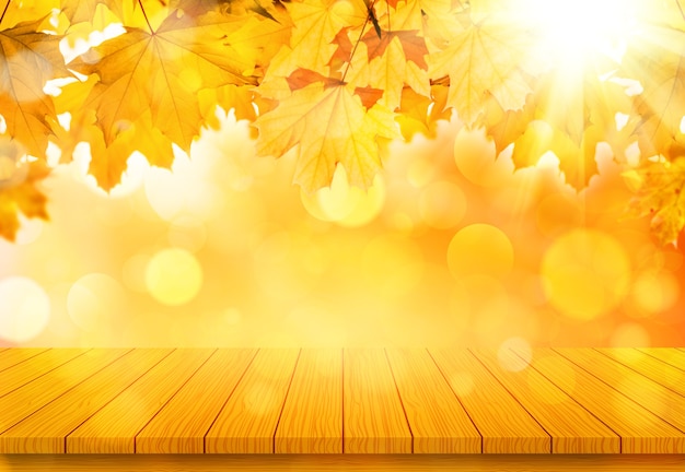 Wooden table with orange fall maple leaves. Autumn natural background