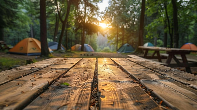 a wooden table with a picnic table and a campfire in the background