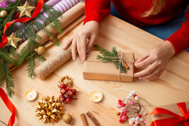 Wooden table with present boxes and decoration for gifts