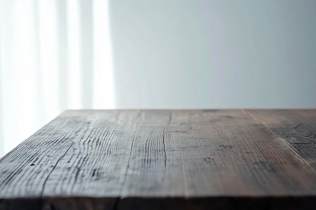 Photo a wooden table with a white background and a white curtain behind it