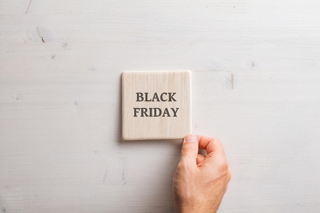 Wooden tile with a Black friday sign on it