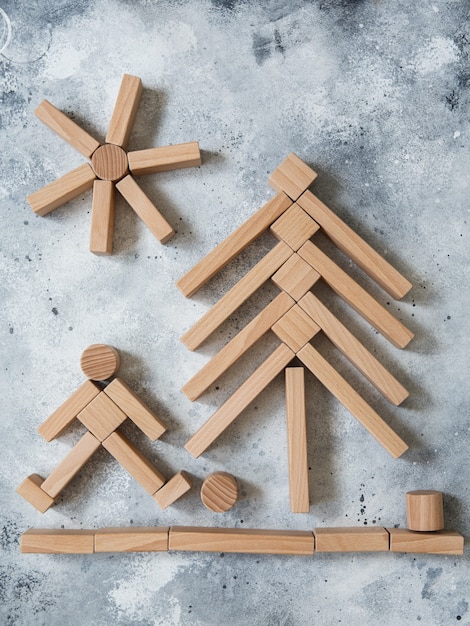 Wooden Toy Construction with ecologically wooden blocks manufactured from sustainable timbers. Wood elements for kids mental development and education. Montessori toys