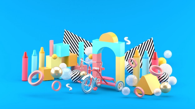 Wooden toys, crayon and bicycles among colorful balls on a blue space.-3d render.