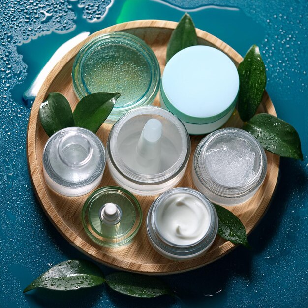 Photo a wooden tray with several different bottles of water and a few bottles of aqua color