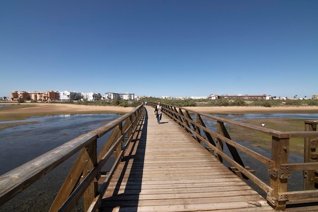 A wooden walkway on the beach of Isla Cristina Spain Widely used by vacationers on vacation