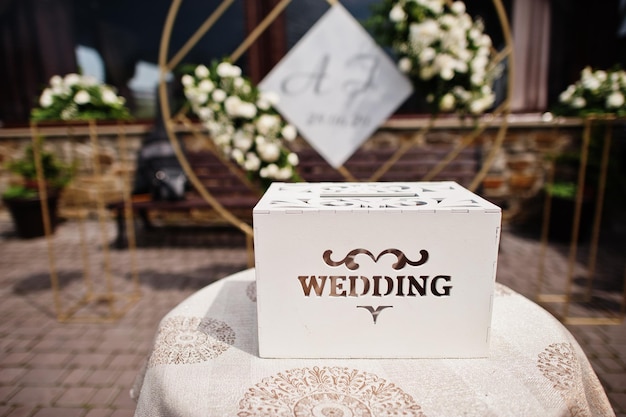 Wooden wedding box for money in table