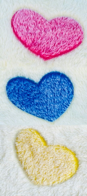 Wool rug texture with colorful heart pattern background