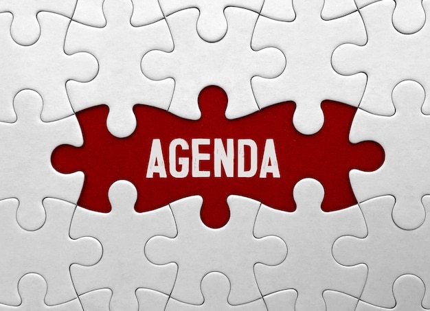 Word Agenda on red puzzle background