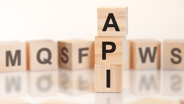 Word API from wooden blocks with letters, concept