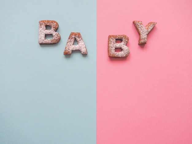 The word Baby cookies . Food background.