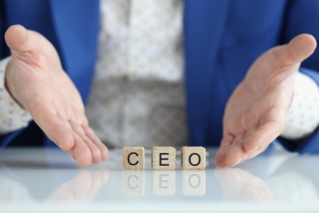 Word ceo on wooden blocks and businessman ceo chief executive officer concept