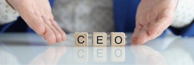 Word ceo on wooden blocks and businessman ceo chief executive officer concept