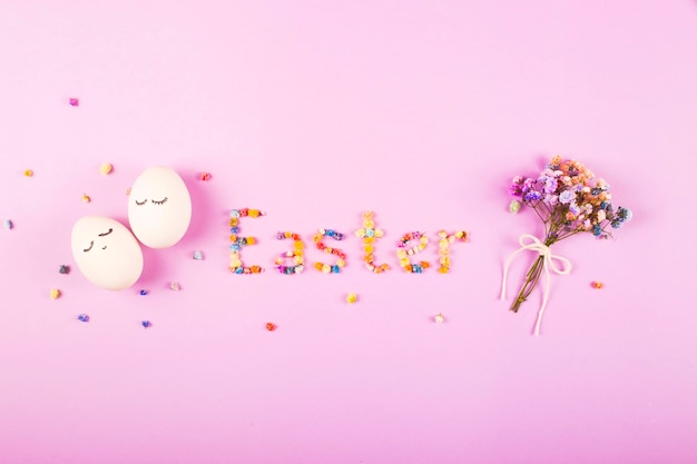 The word Easter is written in small colorful flowers on a purple background.