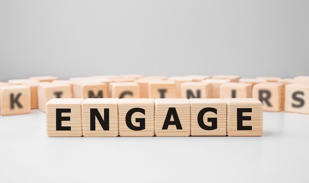 Word ENGAGE written on wood block