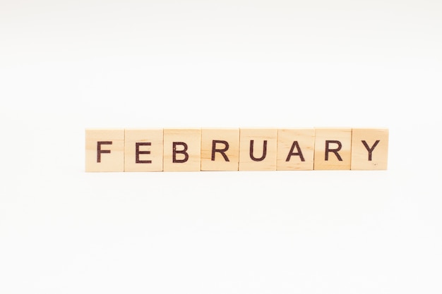 Word February made of wooden blocks isolated