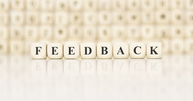 Word FEEDBACK made with wood building blocks