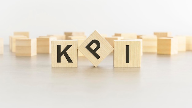 Word KPI is made of wooden blocks on white background