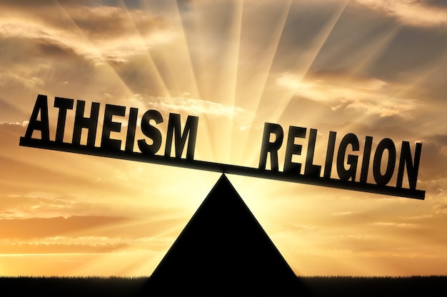 Word religion is more powerful than the word atheism on the scales. Conceptual image of religion