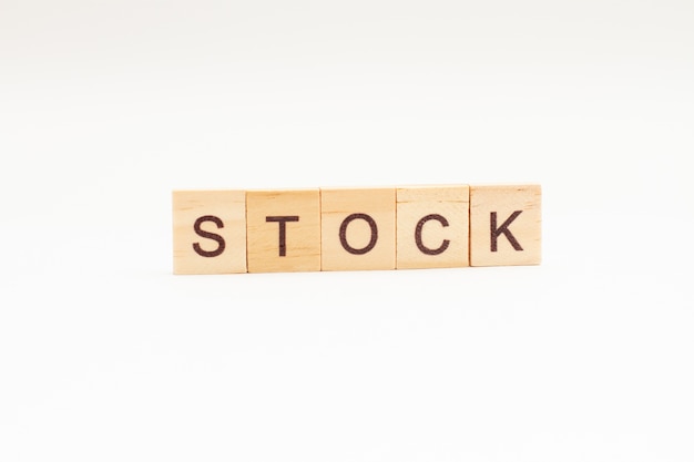 Word STOCK made of wooden blocks isolated