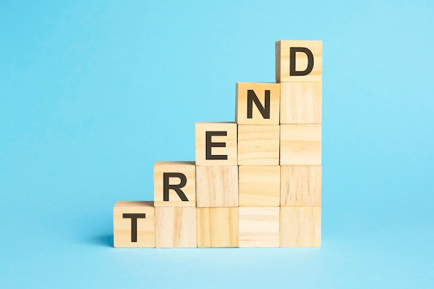 The word TREND is written on a wooden cubes concept