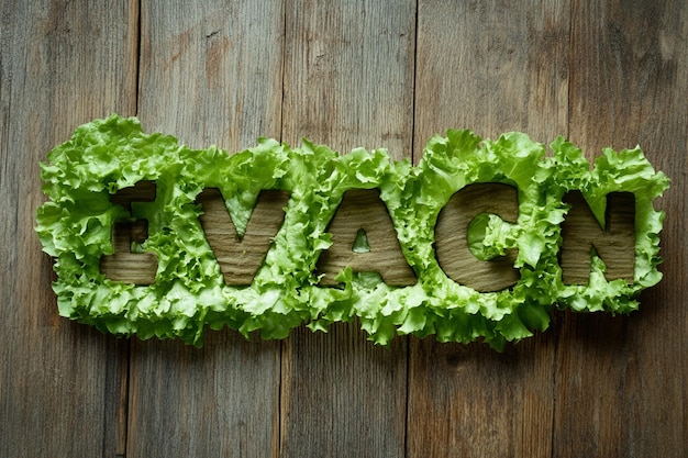 Photo word vegan made of lettuce leaves