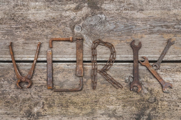 Word Work made of rusty hand tools