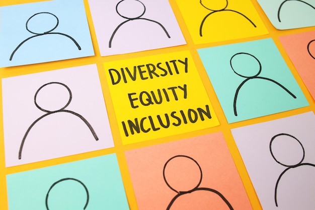 Photo words dei diversity equity inclusion symbol with colorful papers