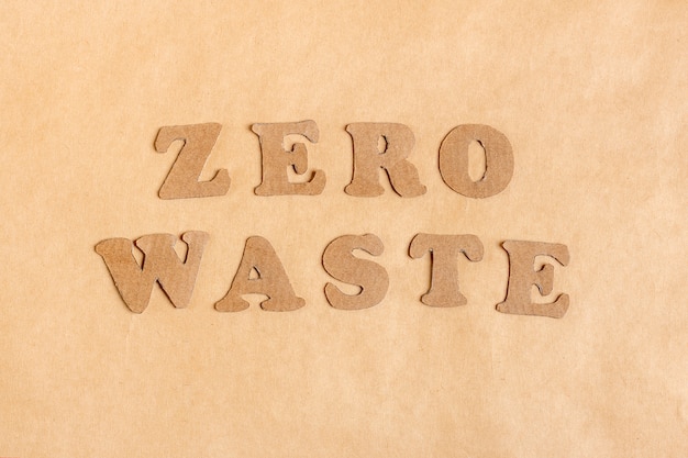 Words from letters Zero Waste cut out of cardboard of craft paper