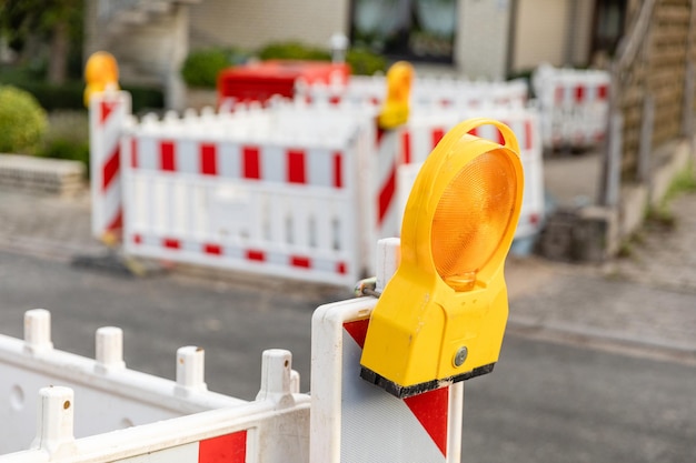 Photo work construction site sign cordoning off on a road