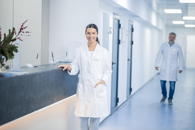 At work Doctors in lab coats in the clinic corridor