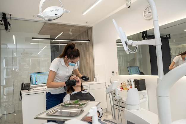 Work of a female dentist in her own dentistry with a girl patient