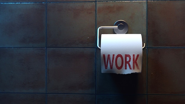 Work lettering on toilet paper in the toilet