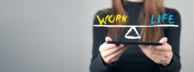 Work Life Balance young woman holding a tablet