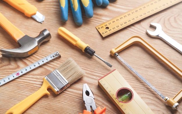 Work tools on wooden background