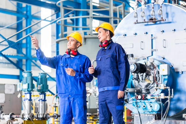 Worker in Asian manufacturing plant