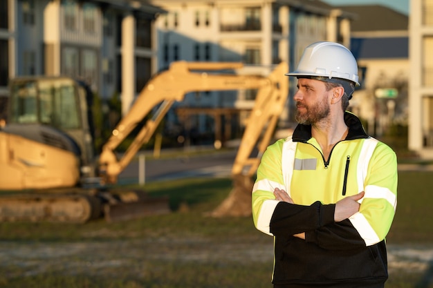 Worker at building site Construction manager in helmet Male construction engineer Architect at a construction site Handyman builder in hardhat Building concept Builder foreman