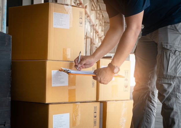 Worker Holding Clipboard His Doing Inventory Management at Storage Warehouse Shipment Check Stock