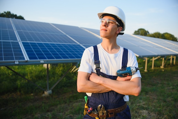 Worker installing solar panels outdoors