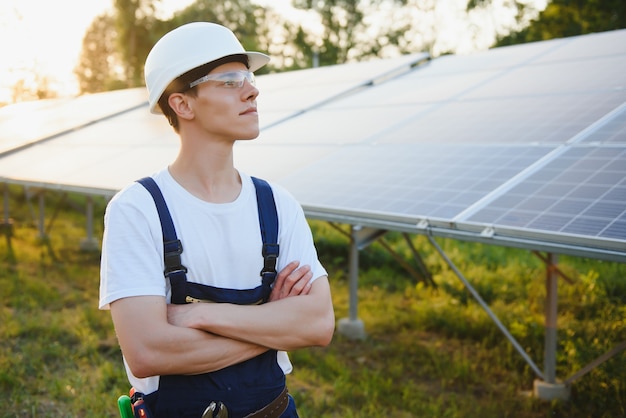 Worker installing solar panels outdoors